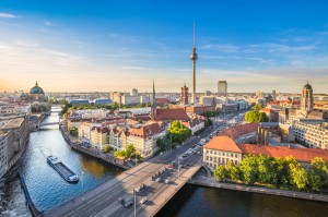 Aerial view of Berlin skyline with famous TV tower and Spree river in beautiful evening light at sunset, Germany