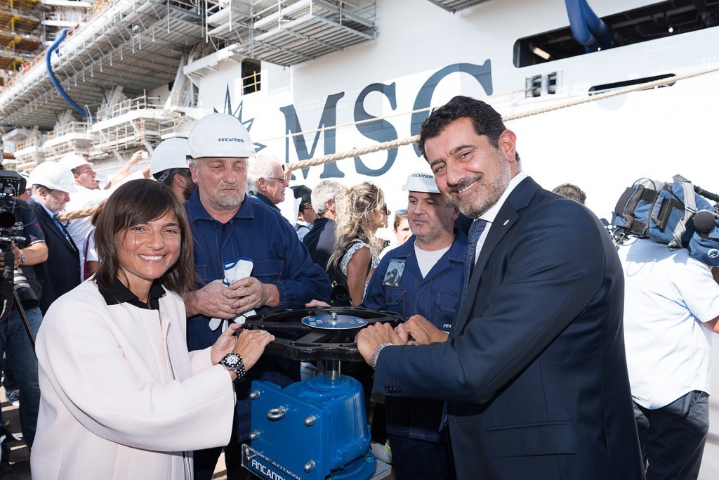 Gianni Onorato and Debora Serracchiani open the valves at the float out ceremony of MSC Seaview