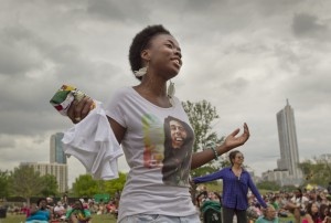 Nasasha Shelton recently moved to Austin and enjoys the sounds of Hail Marley, a Bob Marley tribute band from Austin, who entertains the crowd at the Austin Reggae Festival Sunday on the grass of Butler Park along E. Riverside Drive April 20, 2014. RALPH BARRERA / AMERICAN-STATESMAN