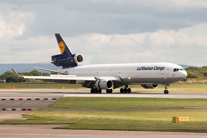 Viracopos passa a contar com nova frequência semanal da Lufthansa 1 Manchester, United Kingdom - August 27, 2015: Lufthansa Cargo MD-11 freight plane landing to Manchester International Airport runway.