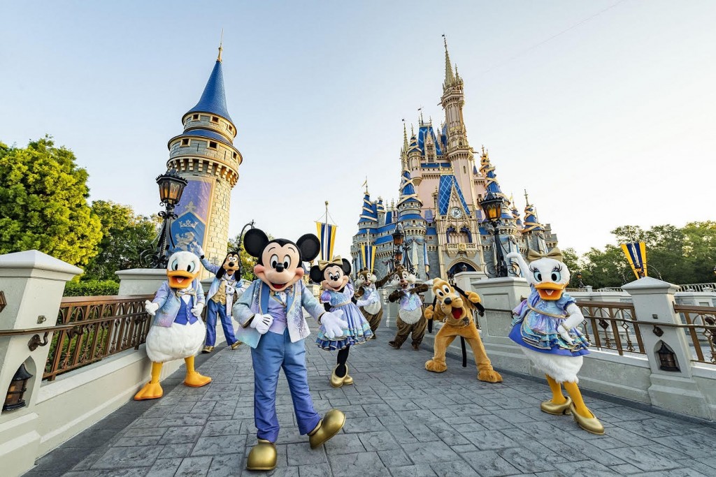 Beginning Oct. 1, 2021, Mickey Mouse and Minnie Mouse will host “The World’s Most Magical Celebration” honoring the 50th anniversary of Walt Disney World Resort in Lake Buena Vista, Fla. Mickey and Minnie will be joined by their best pals Donald Duck, Daisy Duck, Goofy, Pluto and Chip ‘n’ Dale all dressed in sparkling new looks, custom-made for the 18-month event, highlighted by embroidered impressions of Cinderella Castle on multi-toned, EARidescent fabric punctuated with pops of gold. (Matt Stroshane, photographer)